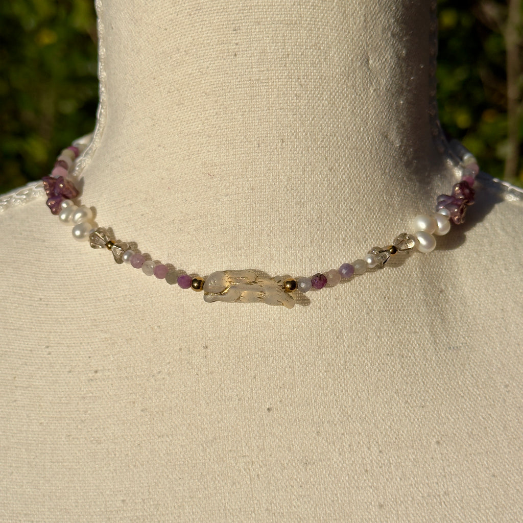 Necklace with pearls and rubies on a mannequin neck