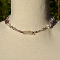 Necklace with pearls and rubies on a mannequin neck