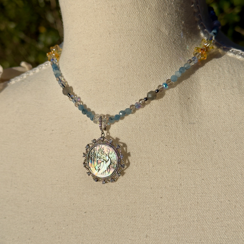 Necklace with a pendant on a mannequin bust