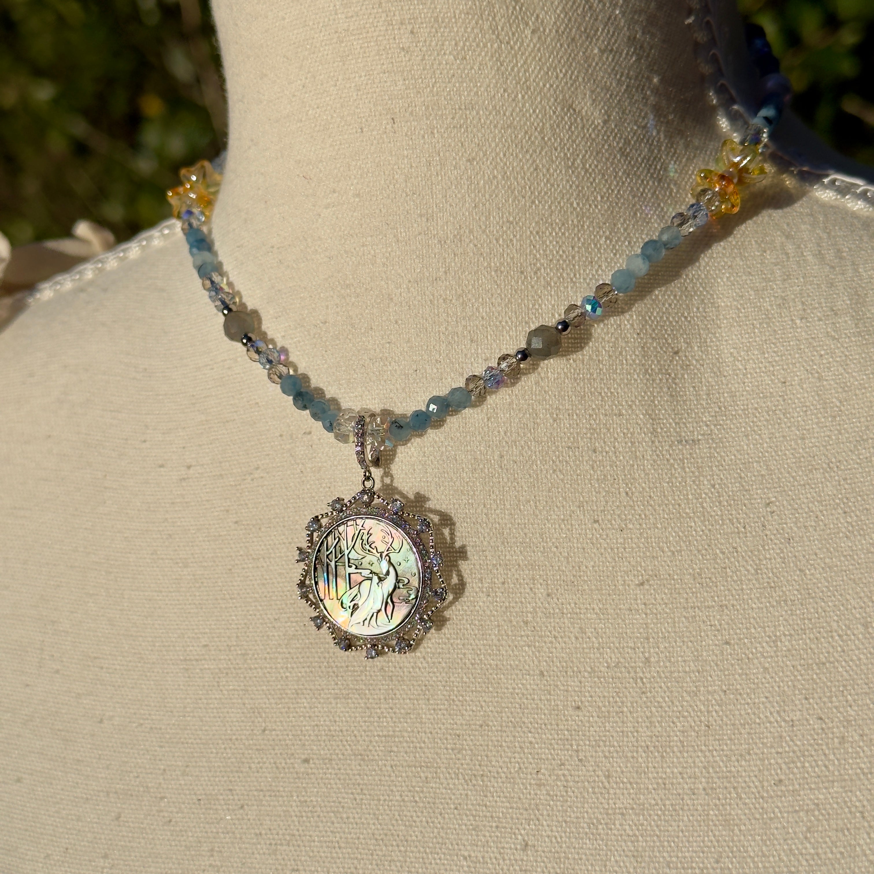 Necklace with a pendant on a mannequin bust