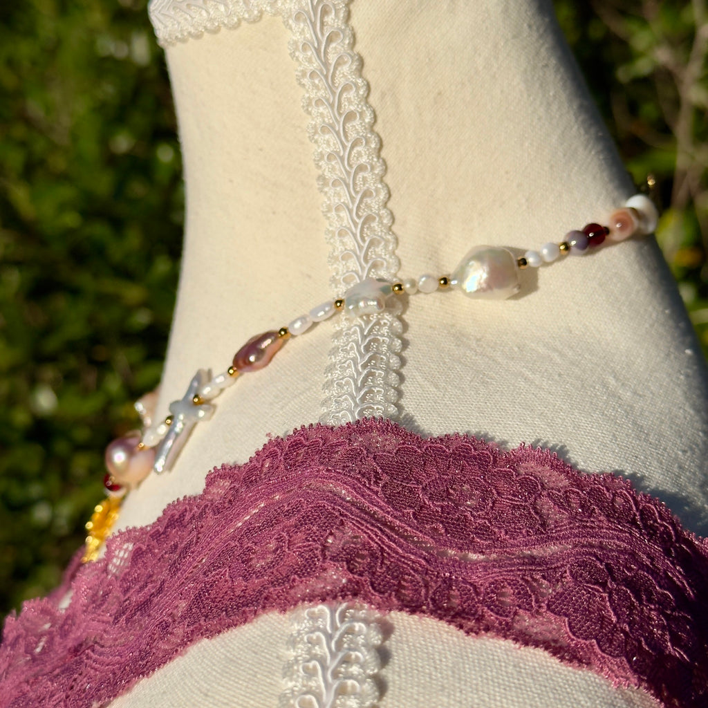 Beaded pearl necklace on mannequin with natural background 
