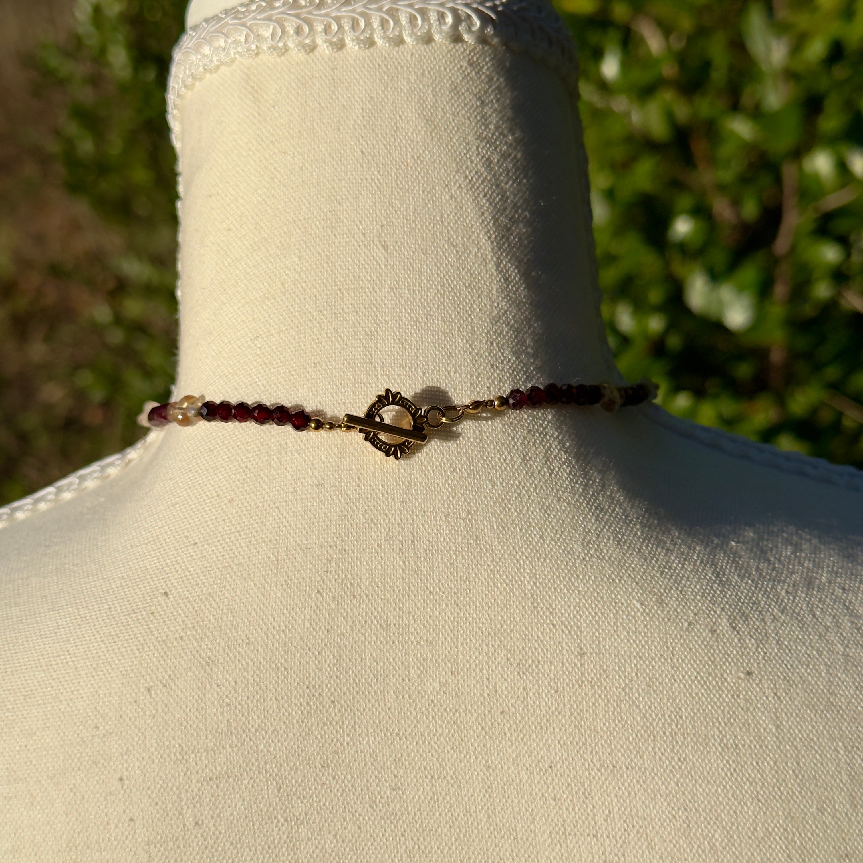 Beaded necklace with gold toggle