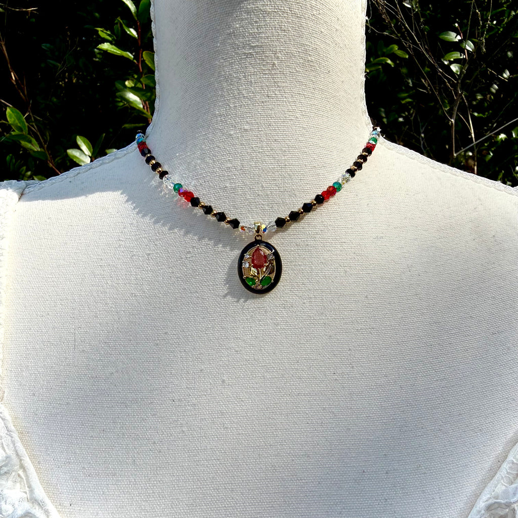 Necklace with a pendant on a mannequin against a natural background