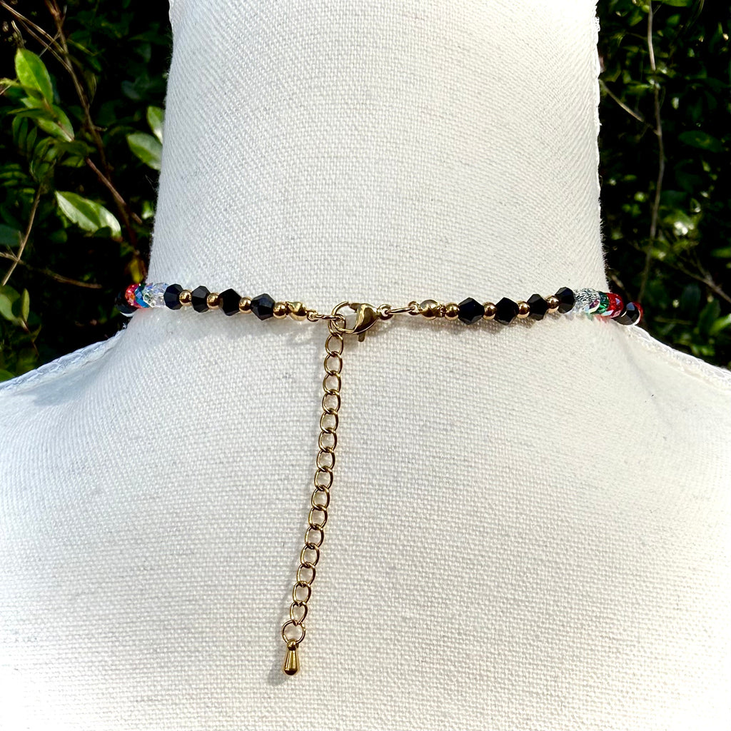 Back of Necklace with beads on a mannequin against a natural background